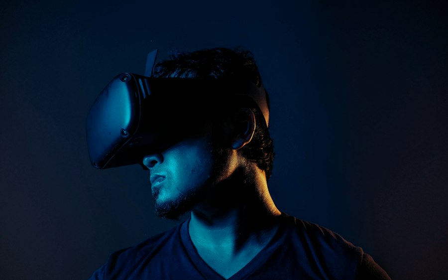 A person in profile wearing a virtual reality headset, lit blue and amber